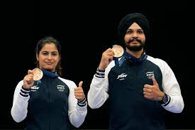 Manu Bhaker and Sarabjot Singh celebrating their bronze medal victory in the 2024 Paris Olympics mixed team 10m air pistol event.