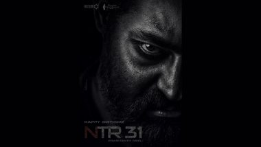 Jr NTR in dramatic pose on 'NTR31' movie poster showcasing intense new look.