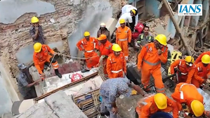 Rescue teams work amidst rubble following the Varanasi house collapse, August 6, 2024